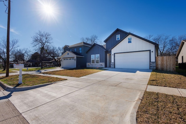 modern farmhouse style home with a garage and a front lawn