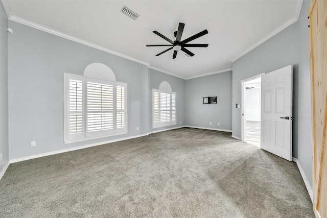 carpeted spare room featuring ceiling fan and ornamental molding