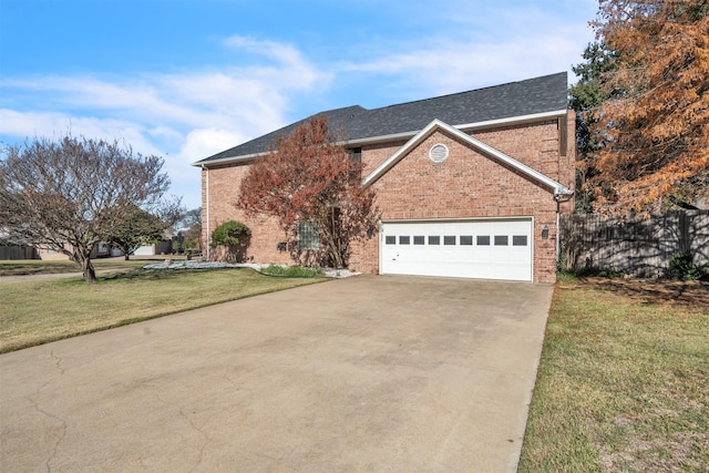 front facade featuring a garage and a front lawn