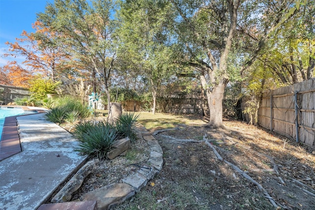 view of yard featuring a covered pool