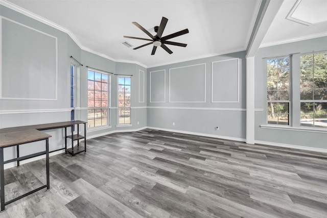 interior space featuring a healthy amount of sunlight, ceiling fan, and ornamental molding