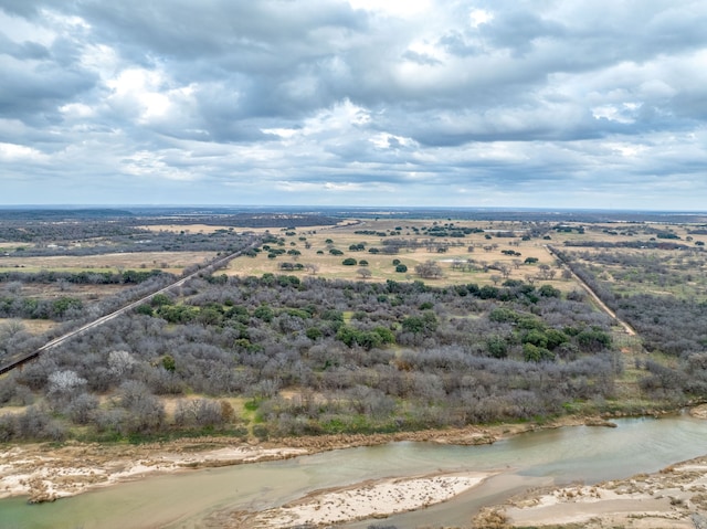 aerial view with a water view and a rural view