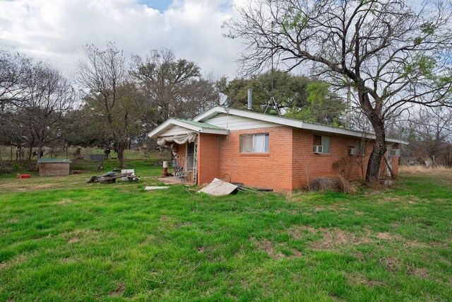 view of property exterior with a yard