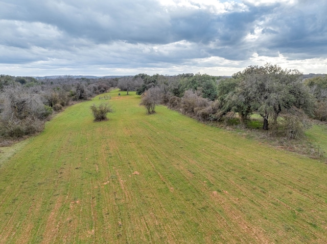 birds eye view of property with a rural view