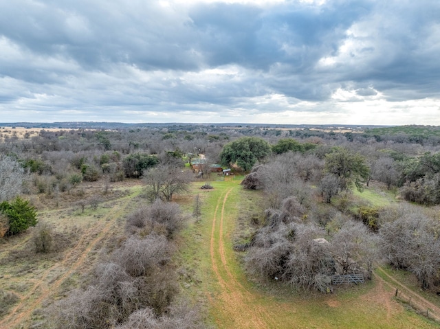 birds eye view of property with a rural view