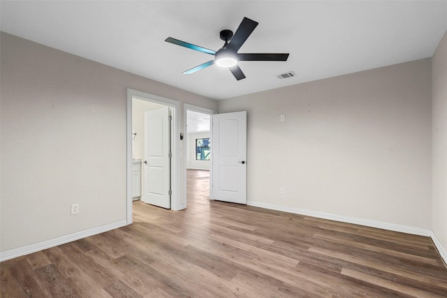 unfurnished bedroom with ceiling fan and light hardwood / wood-style flooring