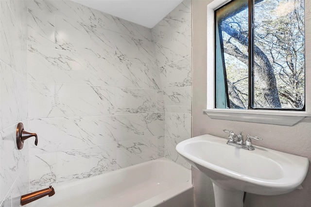 bathroom with sink and a wealth of natural light