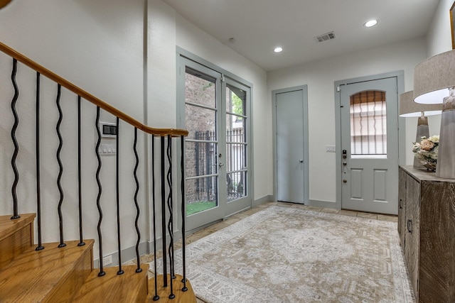 entrance foyer featuring french doors