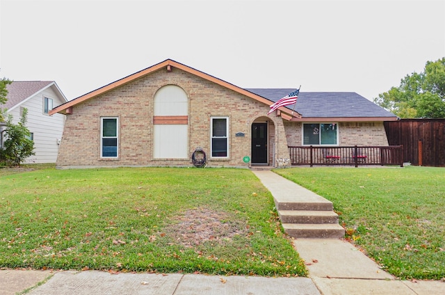 single story home featuring a front yard