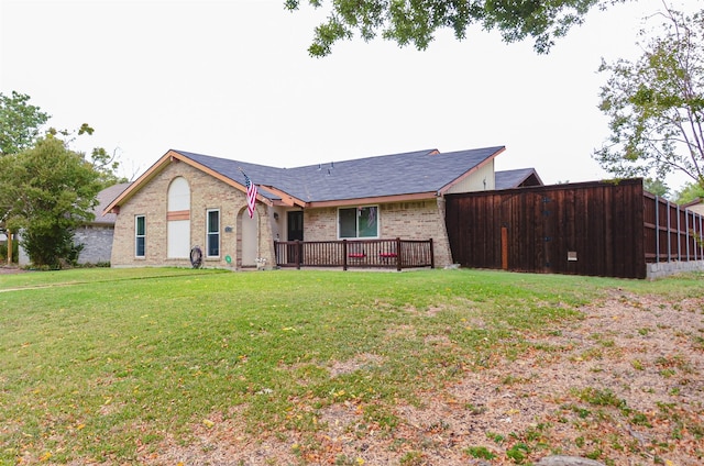 single story home featuring a front lawn