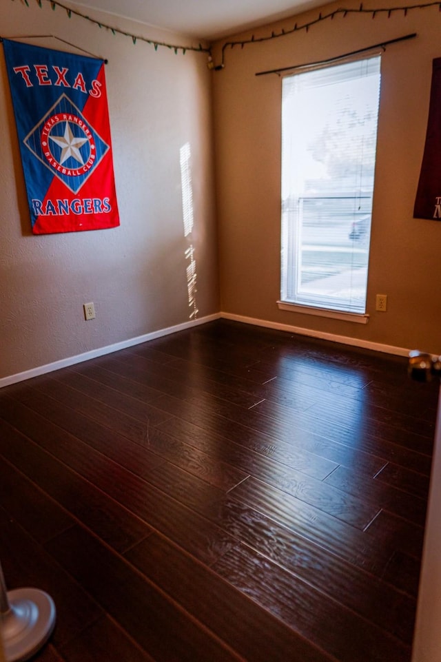 spare room featuring hardwood / wood-style flooring