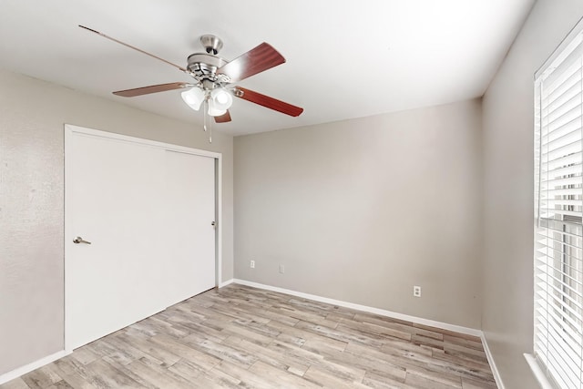 unfurnished bedroom featuring a closet, ceiling fan, and light hardwood / wood-style flooring