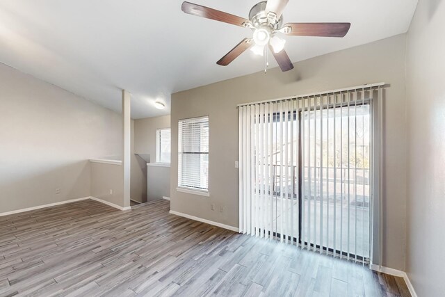 spare room featuring ceiling fan and light wood-type flooring