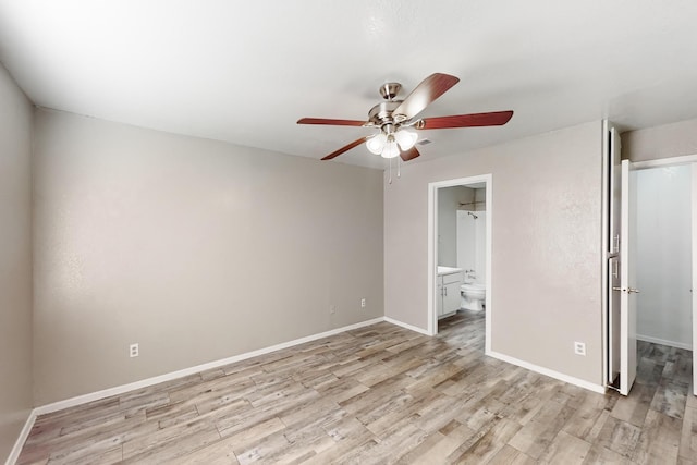 unfurnished bedroom with ceiling fan, connected bathroom, light wood-type flooring, and a closet