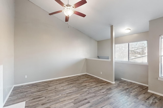 empty room featuring ceiling fan and light wood-type flooring