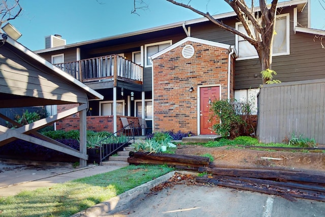 back of house featuring a balcony