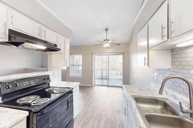 kitchen featuring sink, light hardwood / wood-style flooring, ceiling fan, white cabinetry, and black range with electric cooktop