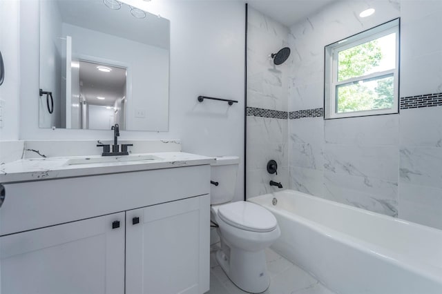 bathroom featuring toilet, vanity, and shower / bath combination