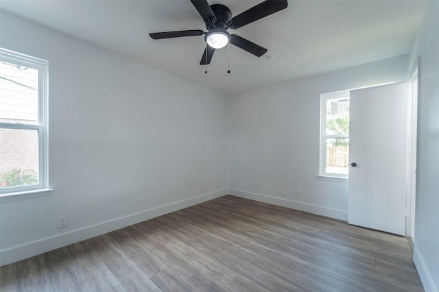 spare room featuring ceiling fan and light wood-type flooring