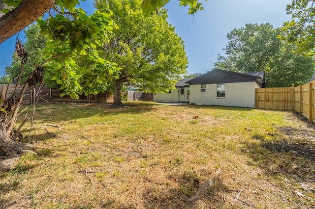view of yard with a fenced backyard