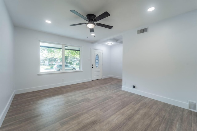 unfurnished room featuring hardwood / wood-style flooring and ceiling fan