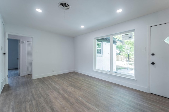 spare room featuring hardwood / wood-style floors