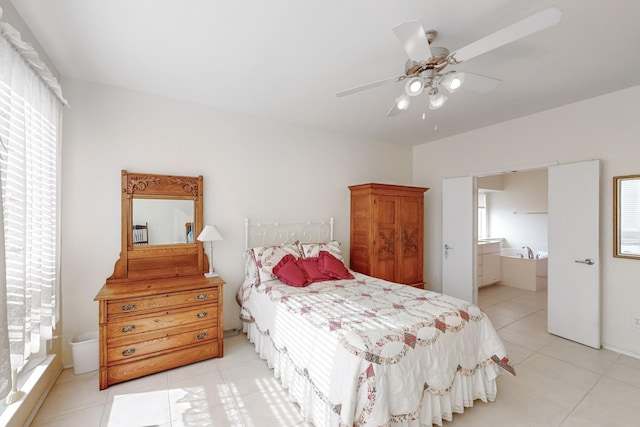 bedroom featuring ceiling fan and ensuite bath