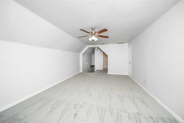 bonus room featuring light carpet, vaulted ceiling, and ceiling fan