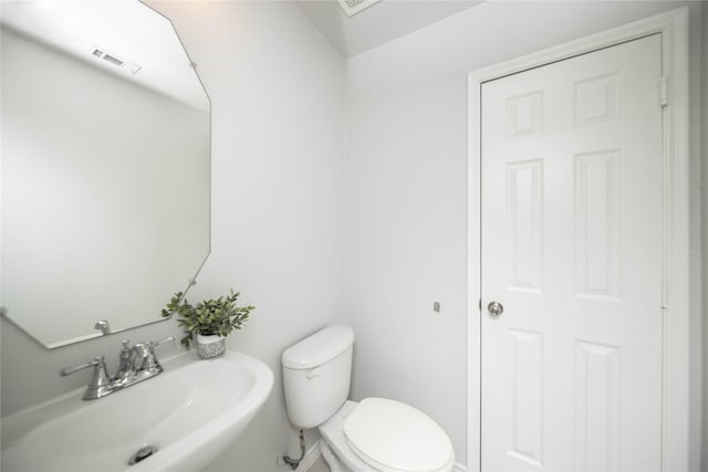 bathroom with sink and toilet