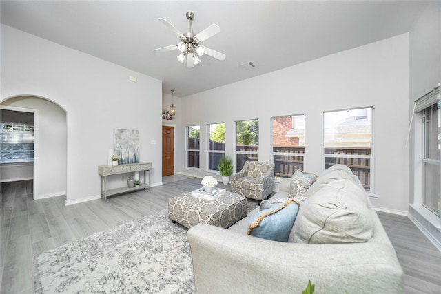 living room with hardwood / wood-style flooring and ceiling fan