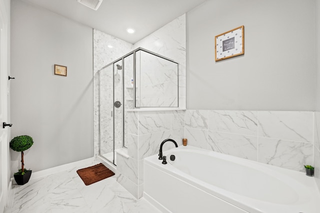 bathroom with shower with separate bathtub