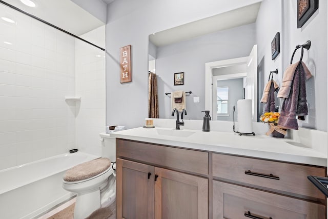 full bathroom featuring shower / bathtub combination with curtain, vanity, and toilet