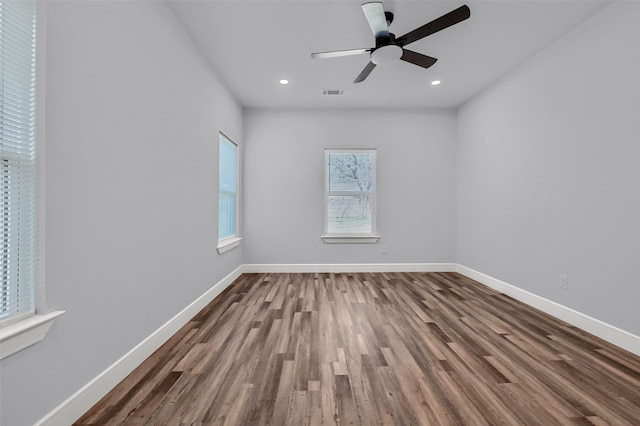 empty room featuring hardwood / wood-style flooring and ceiling fan