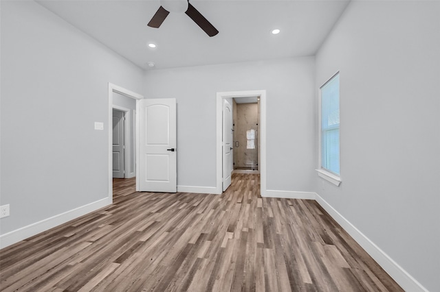 unfurnished bedroom with light wood-type flooring and ceiling fan