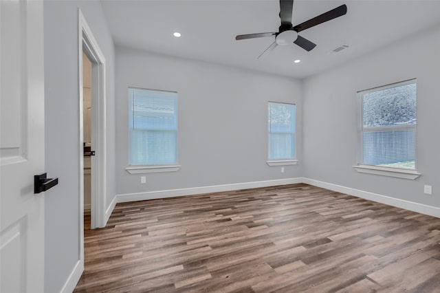 spare room with ceiling fan and light hardwood / wood-style floors