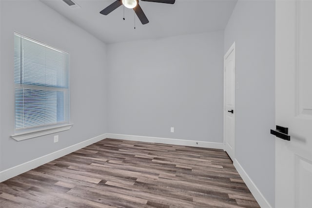 unfurnished room with ceiling fan and wood-type flooring