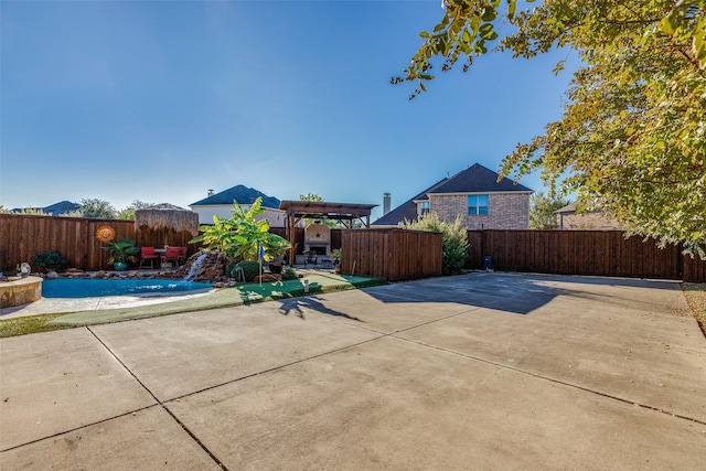 view of patio / terrace featuring a fenced in pool and a pergola