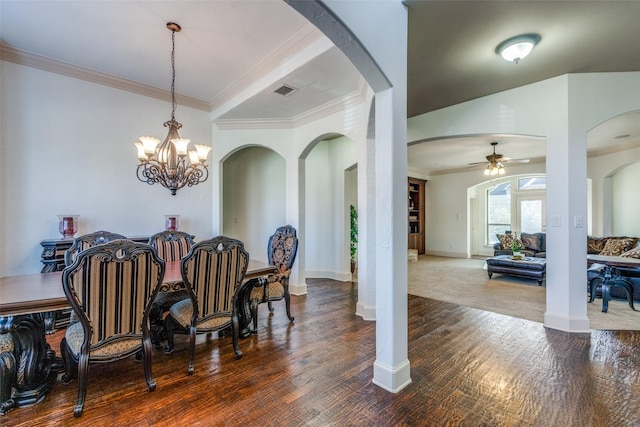 dining space with dark hardwood / wood-style flooring, ceiling fan with notable chandelier, and crown molding