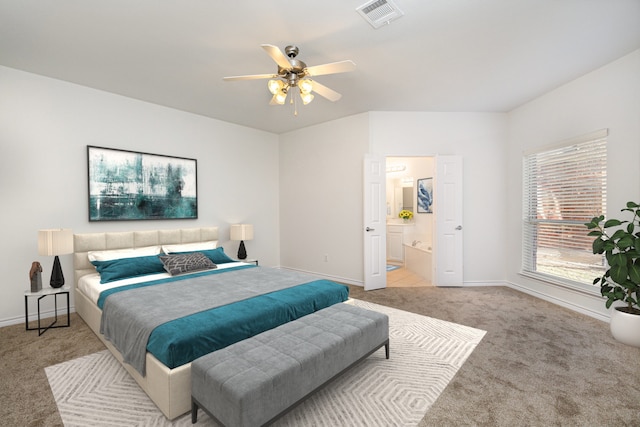 carpeted bedroom featuring ceiling fan and ensuite bathroom