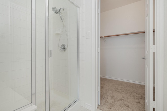 bathroom featuring an enclosed shower