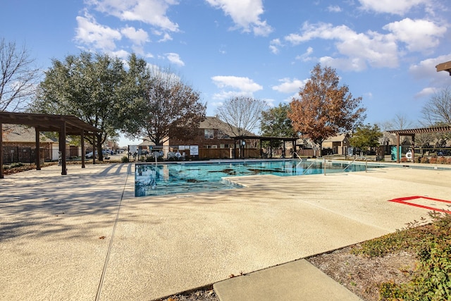 view of pool with a pergola and a patio