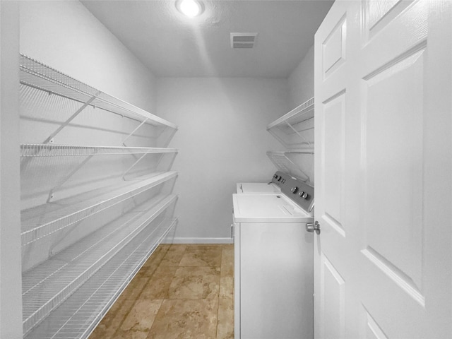 laundry area with washer and clothes dryer