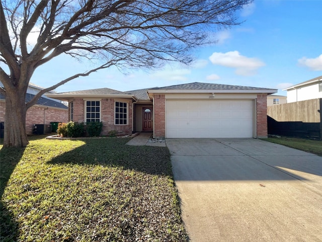 ranch-style home with a garage and a front yard