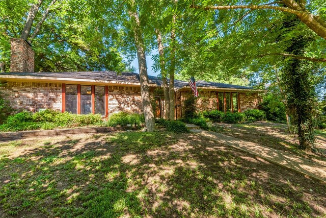 ranch-style house with a front yard