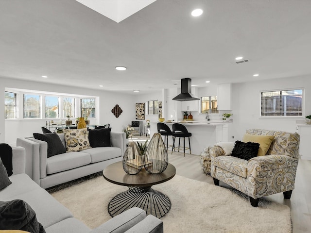 living room with light hardwood / wood-style floors