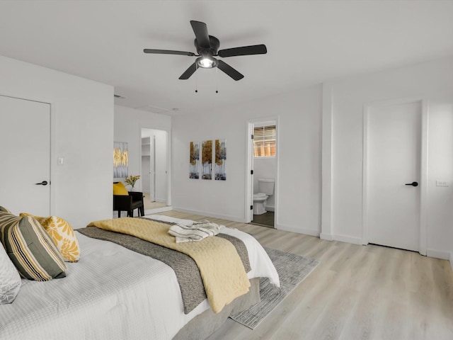 bedroom with ceiling fan, ensuite bath, and light hardwood / wood-style flooring