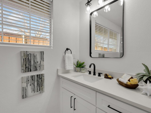 bathroom with vanity and a wealth of natural light