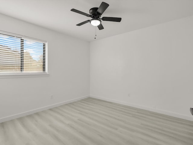 unfurnished room with light hardwood / wood-style flooring and ceiling fan