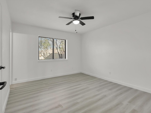 spare room featuring ceiling fan and light wood-type flooring