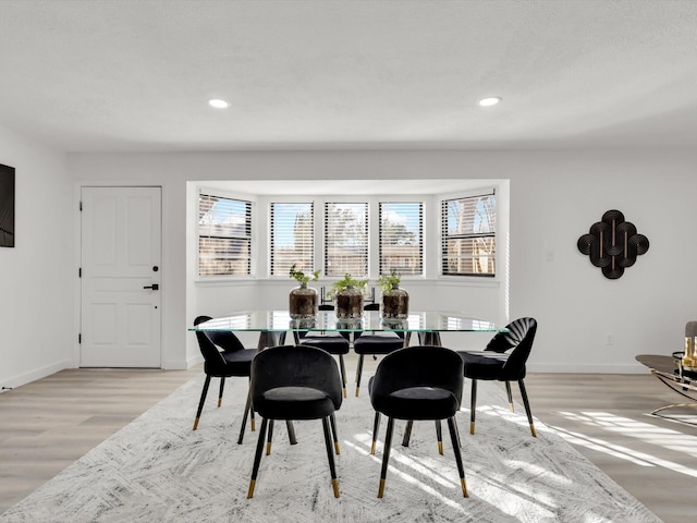 dining area with light hardwood / wood-style flooring